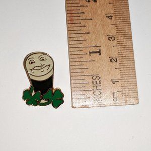 Guinness pint with face and shamrocks enamel pin